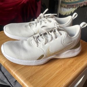 White Nike sneaker with gold accents Women’s 10